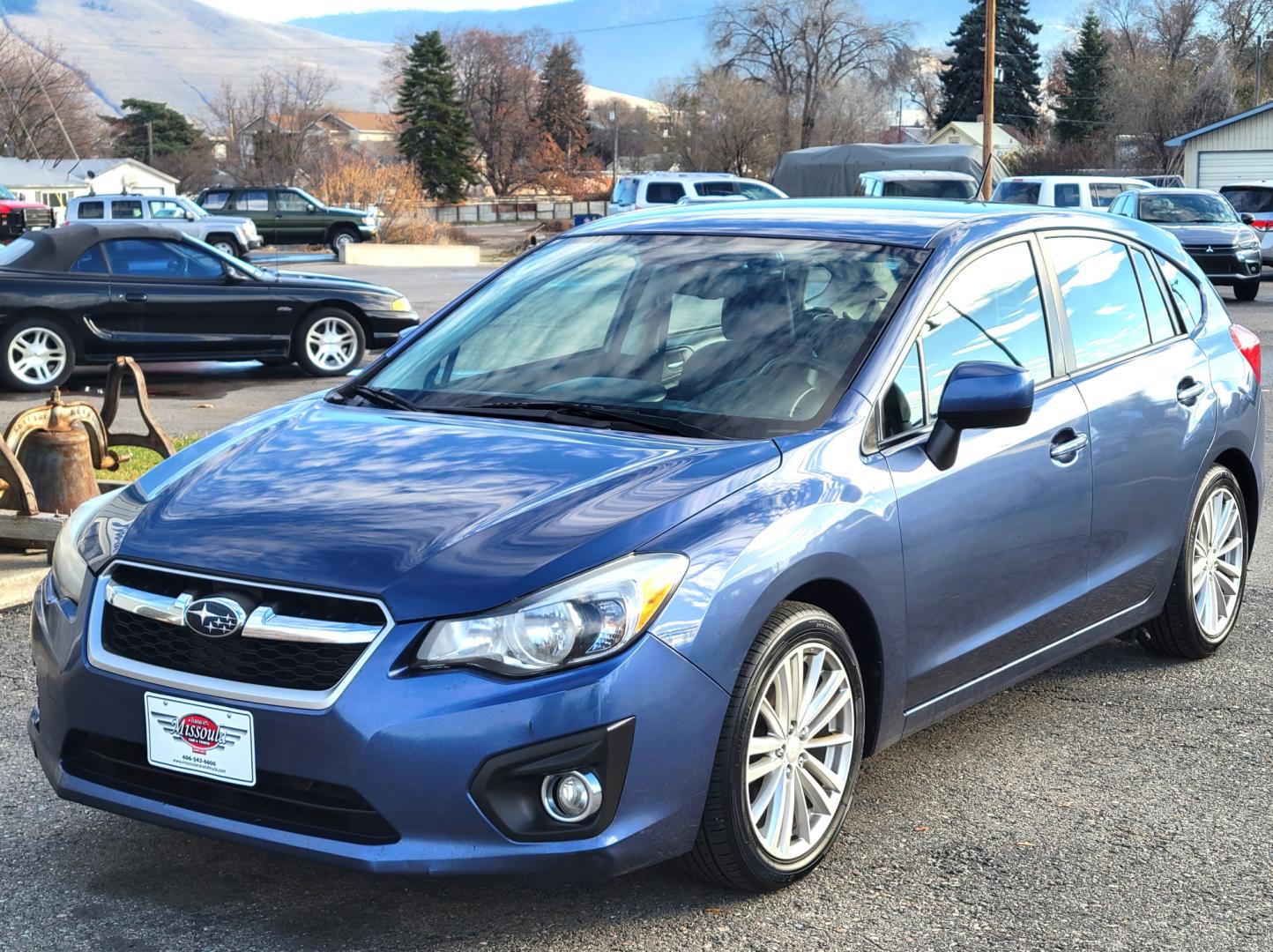 2012 Blue /Black Subaru Impreza Limited 5-Door (JF1GPAG65CH) with an 2.0L H4 DOHC 16V engine, Continuously Variable Transmission transmission, located at 450 N Russell, Missoula, MT, 59801, (406) 543-6600, 46.874496, -114.017433 - Good Runner. Excellent MPG. Automatic Transmission. Heated Seats. Air. Cruise. Tilt. Bluetooth. has Timing Chain. Not a Timing Belt. - Photo#1